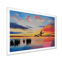 Ptice dizalica koje lete tijekom šarenog zalaska sunca uokvirene slikarstvom platno umjetnički tisak